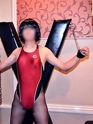 A Japanese crossdresser shemale in a straightjacket BDSM scene.