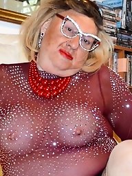 A submissive woman with large breasts engages in sexual activities.