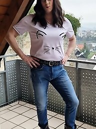 A flexible girl in men s clothes has fun with a cock